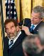 George Bush and Saddam Hussein